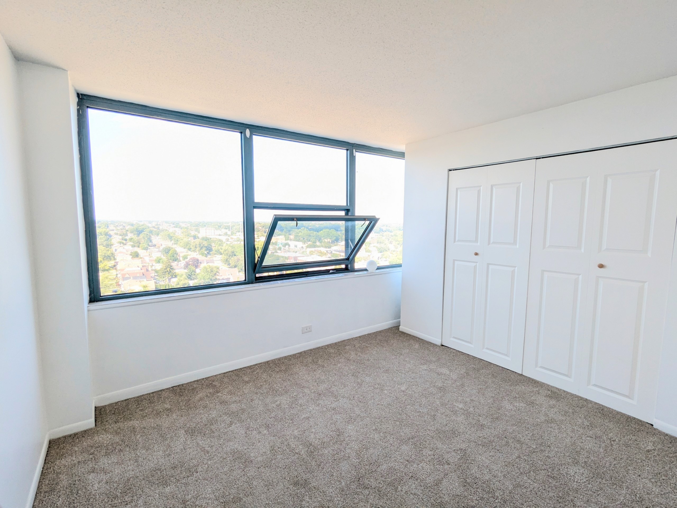 Bright bedroom with wide windows